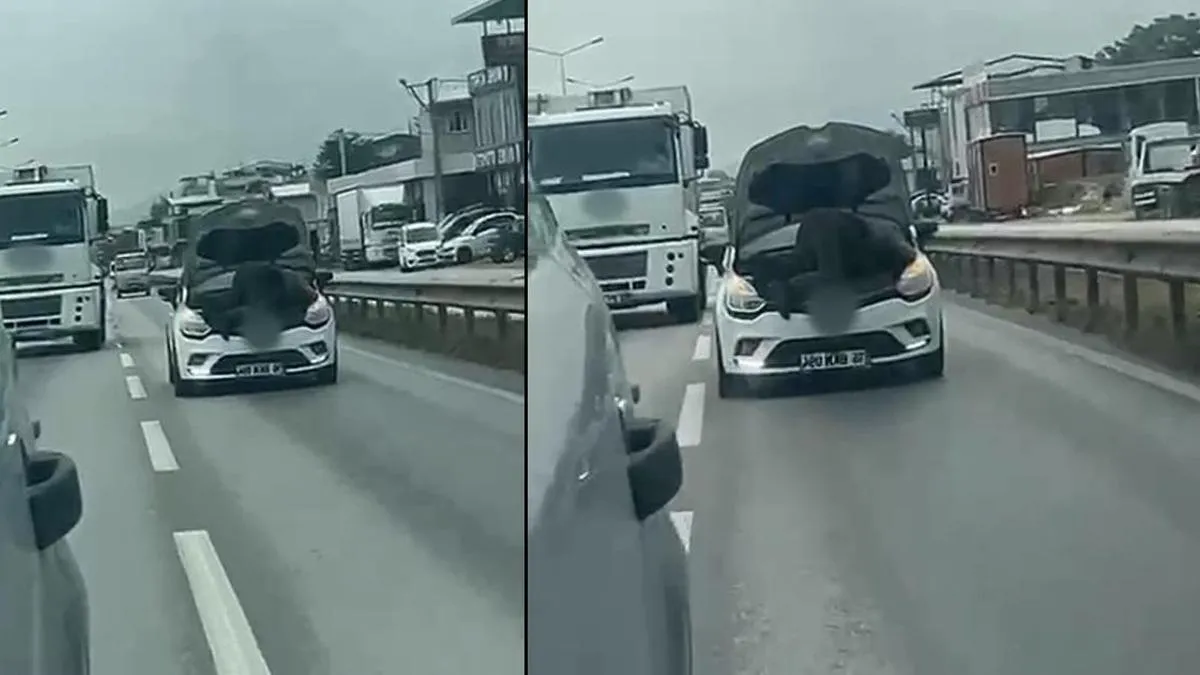Trafikte sürpriz! Hareket halindeki araçta motor tamiri yapan kişi görüntülendi